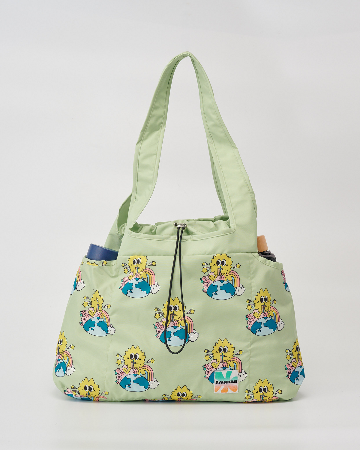 Front view of the Sip and soar water-resistant tote bag in sage with side pockets for a water bottle or compact umbrella